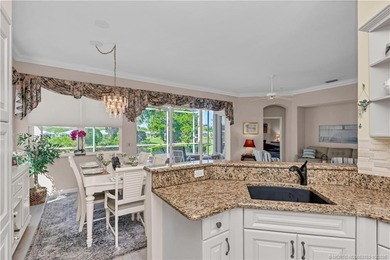 Enjoy breathtaking lake and golf course views from this on Monarch Country Club in Florida - for sale on GolfHomes.com, golf home, golf lot