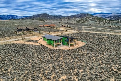 This exquisite residence offers unparalleled luxury and on Eagle Ranch in Colorado - for sale on GolfHomes.com, golf home, golf lot