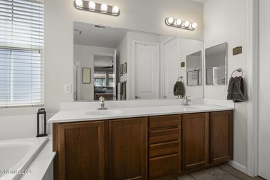 Located in a gated Somersett community, this beautifully on Somersett Country Club in Nevada - for sale on GolfHomes.com, golf home, golf lot