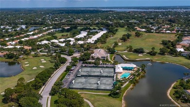 Enjoy breathtaking lake and golf course views from this on Monarch Country Club in Florida - for sale on GolfHomes.com, golf home, golf lot