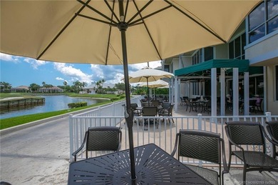 Enjoy breathtaking lake and golf course views from this on Monarch Country Club in Florida - for sale on GolfHomes.com, golf home, golf lot