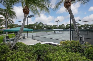 Enjoy breathtaking lake and golf course views from this on Monarch Country Club in Florida - for sale on GolfHomes.com, golf home, golf lot