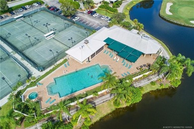 Enjoy breathtaking lake and golf course views from this on Monarch Country Club in Florida - for sale on GolfHomes.com, golf home, golf lot