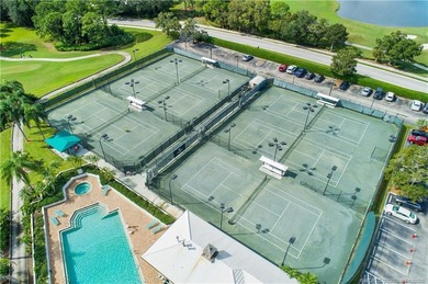 Enjoy breathtaking lake and golf course views from this on Monarch Country Club in Florida - for sale on GolfHomes.com, golf home, golf lot
