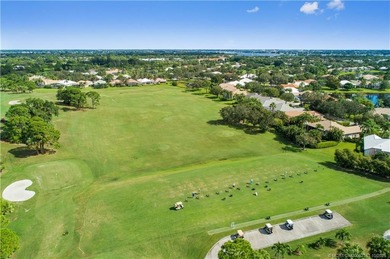 Enjoy breathtaking lake and golf course views from this on Monarch Country Club in Florida - for sale on GolfHomes.com, golf home, golf lot