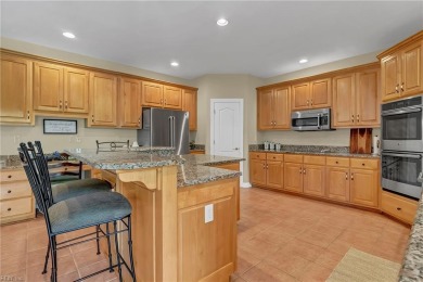 Welcome to your dream home, an all-brick w/ side load three car on Riverfront Golf Club in Virginia - for sale on GolfHomes.com, golf home, golf lot