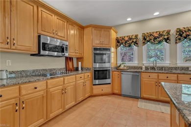 Welcome to your dream home, an all-brick w/ side load three car on Riverfront Golf Club in Virginia - for sale on GolfHomes.com, golf home, golf lot