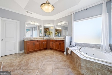 Experience luxury living at its finest with this stunning on Collins Hill Golf Club in Georgia - for sale on GolfHomes.com, golf home, golf lot