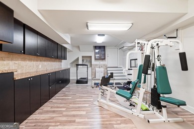 Experience luxury living at its finest with this stunning on Collins Hill Golf Club in Georgia - for sale on GolfHomes.com, golf home, golf lot