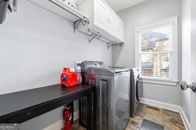 Experience luxury living at its finest with this stunning on Collins Hill Golf Club in Georgia - for sale on GolfHomes.com, golf home, golf lot