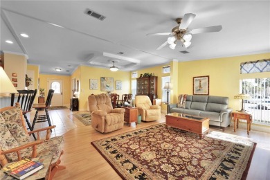 This TRIPLE-wide Palm Harbor home is situated on a spacious on Maple Leaf Golf and Country Club in Florida - for sale on GolfHomes.com, golf home, golf lot