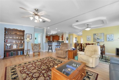 This TRIPLE-wide Palm Harbor home is situated on a spacious on Maple Leaf Golf and Country Club in Florida - for sale on GolfHomes.com, golf home, golf lot