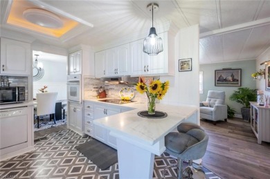 This lovely home has custom updates throughout that give it a on Riviera Golf Club in Florida - for sale on GolfHomes.com, golf home, golf lot