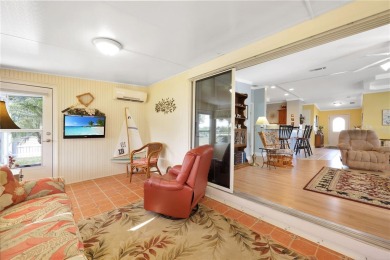 This TRIPLE-wide Palm Harbor home is situated on a spacious on Maple Leaf Golf and Country Club in Florida - for sale on GolfHomes.com, golf home, golf lot