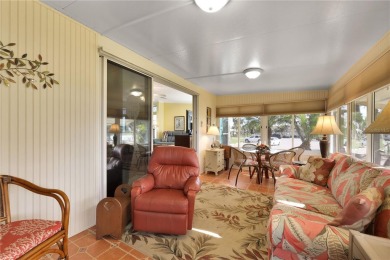 This TRIPLE-wide Palm Harbor home is situated on a spacious on Maple Leaf Golf and Country Club in Florida - for sale on GolfHomes.com, golf home, golf lot