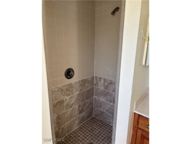 Price Reduced. Welcome to this beautiful 3-bedroom, 2-bath home on Mirror Lakes Golf Club in Florida - for sale on GolfHomes.com, golf home, golf lot