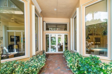 This stunning and meticulously maintained two-story courtyard on Country Club At Mirasol in Florida - for sale on GolfHomes.com, golf home, golf lot