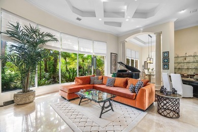 This stunning and meticulously maintained two-story courtyard on Country Club At Mirasol in Florida - for sale on GolfHomes.com, golf home, golf lot