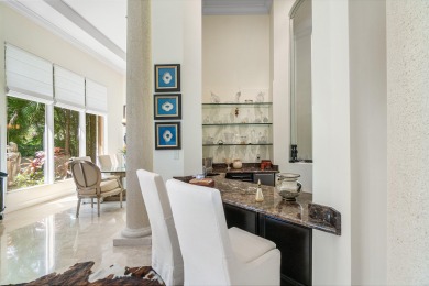 This stunning and meticulously maintained two-story courtyard on Country Club At Mirasol in Florida - for sale on GolfHomes.com, golf home, golf lot