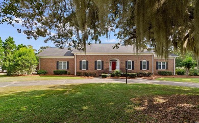 Welcome to this elegant and spacious traditional home nestled in on Wedgefield Plantation Golf Club in South Carolina - for sale on GolfHomes.com, golf home, golf lot