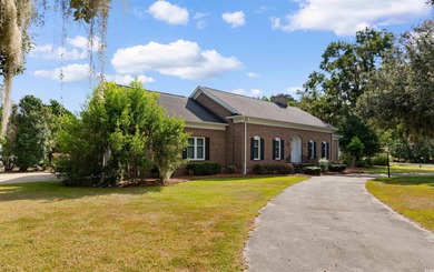 Welcome to this elegant and spacious traditional home nestled in on Wedgefield Plantation Golf Club in South Carolina - for sale on GolfHomes.com, golf home, golf lot