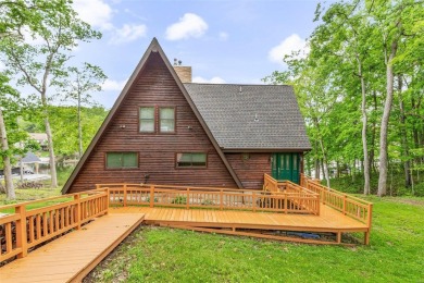 Welcome to your dream Lodge-like home nestled on a sprawling on Raintree Country Club in Missouri - for sale on GolfHomes.com, golf home, golf lot