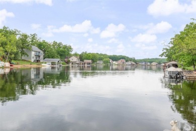 Welcome to your dream Lodge-like home nestled on a sprawling on Raintree Country Club in Missouri - for sale on GolfHomes.com, golf home, golf lot