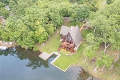 Welcome to your dream Lodge-like home nestled on a sprawling on Raintree Country Club in Missouri - for sale on GolfHomes.com, golf home, golf lot