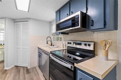 This charming end-unit condo in Derby Downs offers a peaceful on Country Club At Silver Springs Shores in Florida - for sale on GolfHomes.com, golf home, golf lot