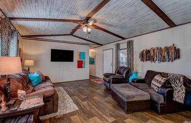 Sitting on three lots.  This Immaculate 3-bedroom, 2-bath home on Mountain Ranch Golf Club in Arkansas - for sale on GolfHomes.com, golf home, golf lot
