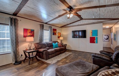 Sitting on three lots.  This Immaculate 3-bedroom, 2-bath home on Mountain Ranch Golf Club in Arkansas - for sale on GolfHomes.com, golf home, golf lot