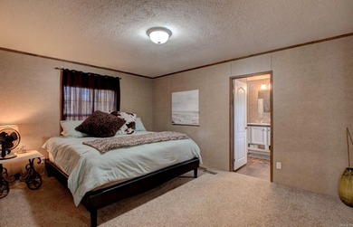Sitting on three lots.  This Immaculate 3-bedroom, 2-bath home on Mountain Ranch Golf Club in Arkansas - for sale on GolfHomes.com, golf home, golf lot