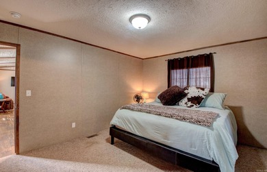 Sitting on three lots.  This Immaculate 3-bedroom, 2-bath home on Mountain Ranch Golf Club in Arkansas - for sale on GolfHomes.com, golf home, golf lot
