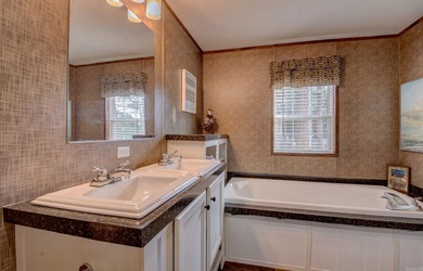 Sitting on three lots.  This Immaculate 3-bedroom, 2-bath home on Mountain Ranch Golf Club in Arkansas - for sale on GolfHomes.com, golf home, golf lot