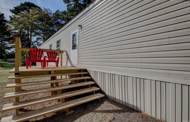 Sitting on three lots.  This Immaculate 3-bedroom, 2-bath home on Mountain Ranch Golf Club in Arkansas - for sale on GolfHomes.com, golf home, golf lot