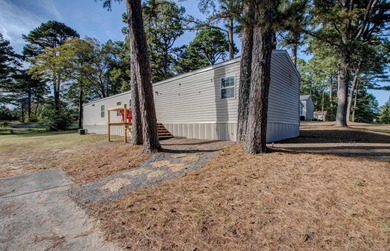 Sitting on three lots.  This Immaculate 3-bedroom, 2-bath home on Mountain Ranch Golf Club in Arkansas - for sale on GolfHomes.com, golf home, golf lot