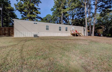 Sitting on three lots.  This Immaculate 3-bedroom, 2-bath home on Mountain Ranch Golf Club in Arkansas - for sale on GolfHomes.com, golf home, golf lot