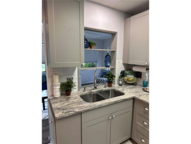 This 2 bedroom 1.5 bath home is located in the 55+ COMMUNITY of on Mainlands Golf Club in Florida - for sale on GolfHomes.com, golf home, golf lot