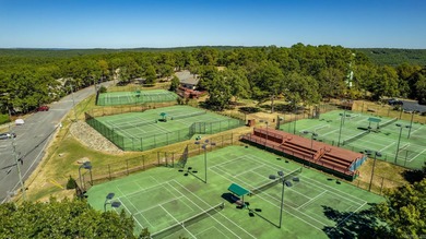 Sitting on three lots.  This Immaculate 3-bedroom, 2-bath home on Mountain Ranch Golf Club in Arkansas - for sale on GolfHomes.com, golf home, golf lot