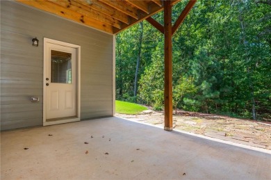 Peaceful living meets modern comfort in this stunning Canton on The Fairways at Laurel Canyon in Georgia - for sale on GolfHomes.com, golf home, golf lot