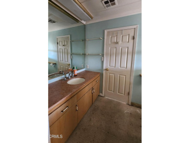 Bring your tool belt for this fixer home nestled in the corner on Saticoy Regional Golf Course in California - for sale on GolfHomes.com, golf home, golf lot