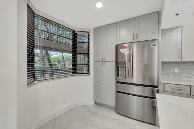 This is a must see!! Completely redone.Gorgeous fully remodeled on The Country Club At Boca Raton in Florida - for sale on GolfHomes.com, golf home, golf lot