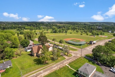 Step into a piece of history with this enchanting 1880s-era home on Mayville Golf Club in Wisconsin - for sale on GolfHomes.com, golf home, golf lot