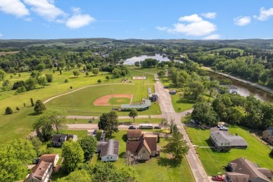 Step into a piece of history with this enchanting 1880s-era home on Mayville Golf Club in Wisconsin - for sale on GolfHomes.com, golf home, golf lot