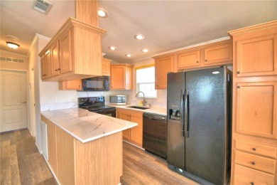 LOOK NO FURTHER...FLORIDA LIFESTYLE AT ITS BEST! THIS 2012 on Southern Dunes Golf and Country Club in Florida - for sale on GolfHomes.com, golf home, golf lot
