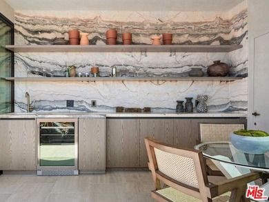 High above the city, at the very crown of the iconic Wilshire on Los Angeles Country Club in California - for sale on GolfHomes.com, golf home, golf lot