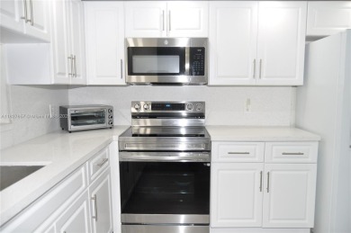 Totally remodeled,  new look,  spacious and beautiful  2/2 FIRST on Flamingo Lakes Country Club in Florida - for sale on GolfHomes.com, golf home, golf lot