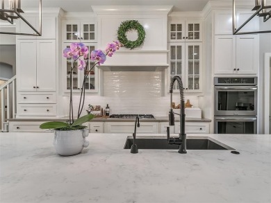 Blending elegance with everyday comfort, this stunning home is on Oak Tree National Golf and Country Club in Oklahoma - for sale on GolfHomes.com, golf home, golf lot