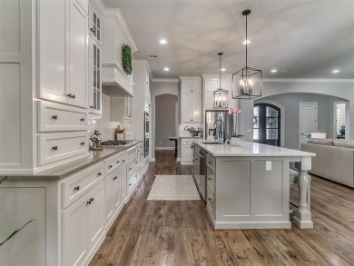 Blending elegance with everyday comfort, this stunning home is on Oak Tree National Golf and Country Club in Oklahoma - for sale on GolfHomes.com, golf home, golf lot