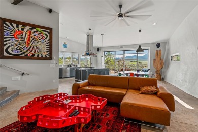 Live inside a work of art in this Artist's Dream Dwelling in on Taos Country Club in New Mexico - for sale on GolfHomes.com, golf home, golf lot